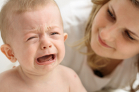 baby crying with mom teething remedies