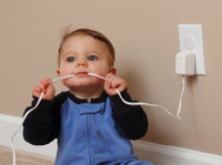 baby chewing a elec cord