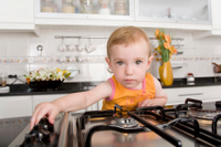 baby turing on stove