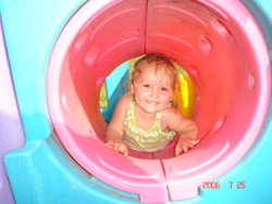 child in play tunnel