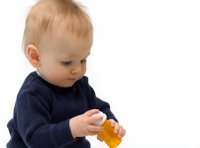 baby with pill bottle
