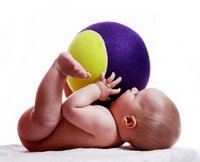 baby with a big ball on top part of toddler development