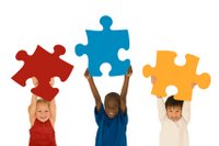 kids hold puzzle pieces