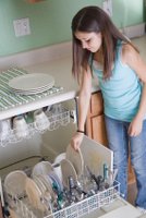 girl loading dishes