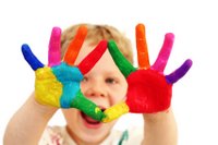 early child development with colored hands